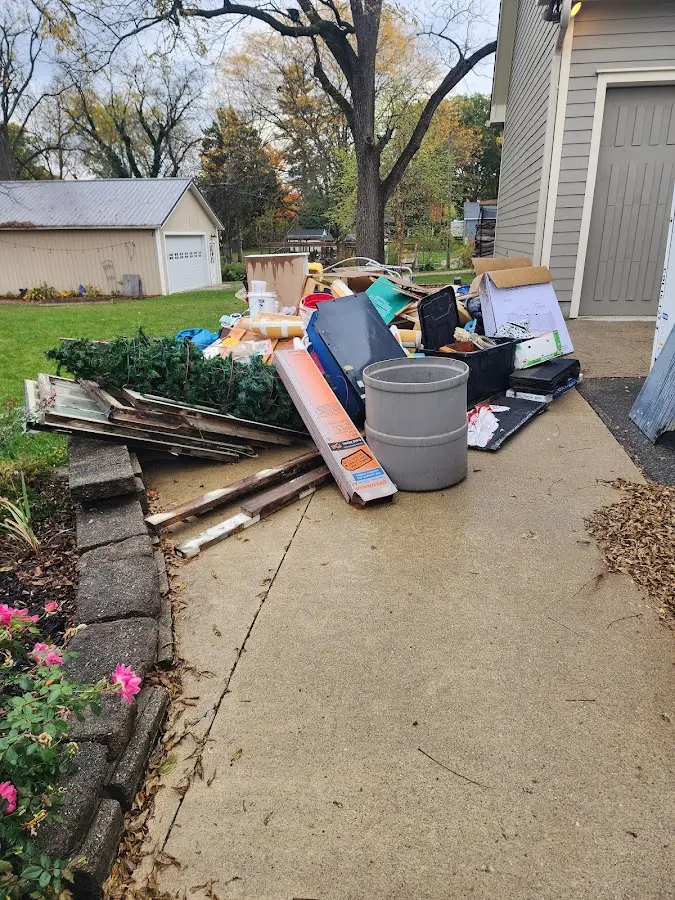 Dumpster being loaded with debris for 3 Yard Dumpster Rental in Kahaluu-Keauhou
